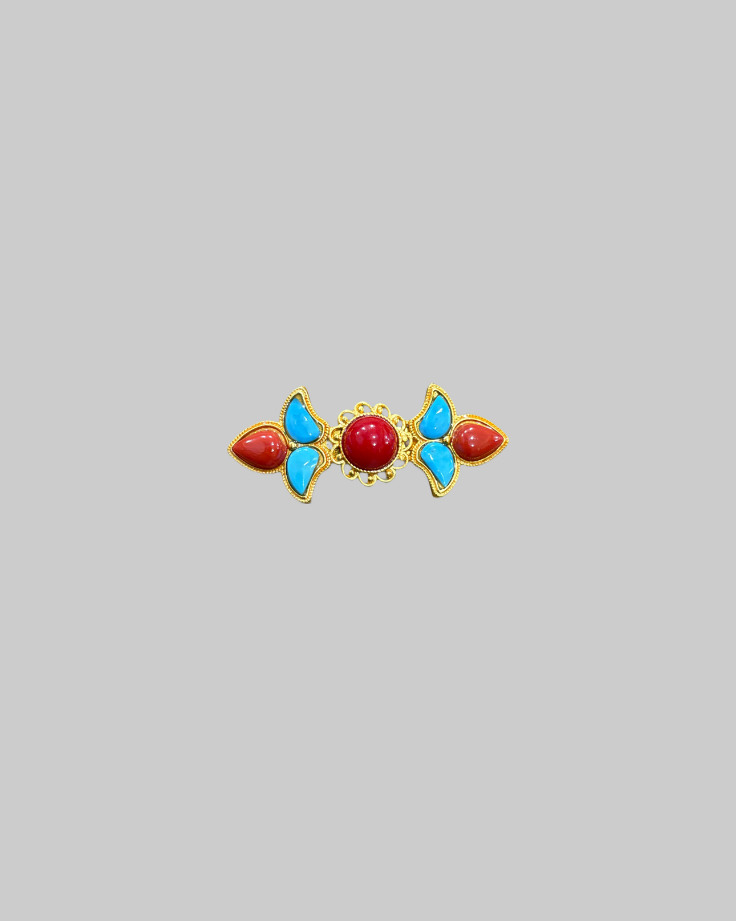 Traditional Tibetan-Style Brooch with Red Coral & Turquoise Stones in Gold-Tone Metal front Traditional Tibetan-Style Brooch with Red Coral & Turquoise Stones in Gold-Tone Metal - Image 1